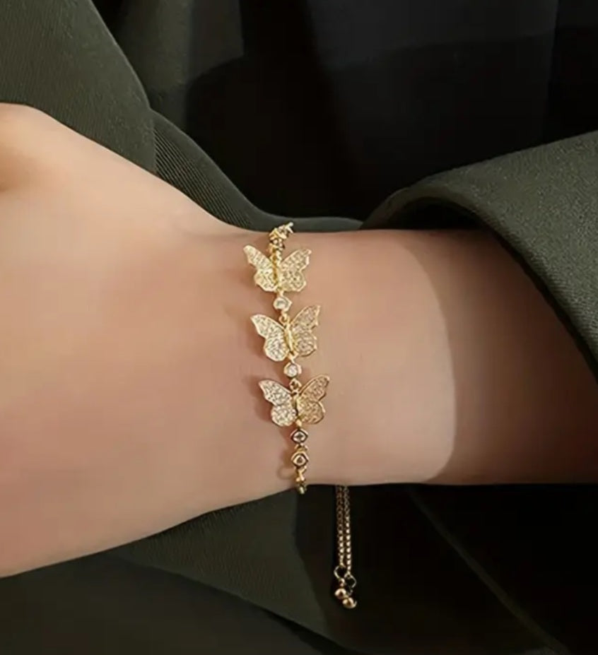 Pulsera ajustable de mariposas con brillantes/Adjustable butterfly bracelet with rhinestones