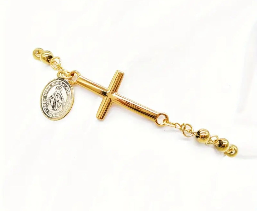 Pulsera de acero inoxidable con cruz y dije de Virgen Maria/ Stainless steel bracelet with cross and Virgin Mary charm.