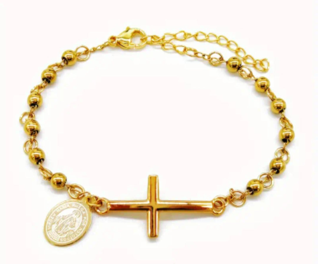 Pulsera de acero inoxidable con cruz y dije de Virgen Maria/ Stainless steel bracelet with cross and Virgin Mary charm.