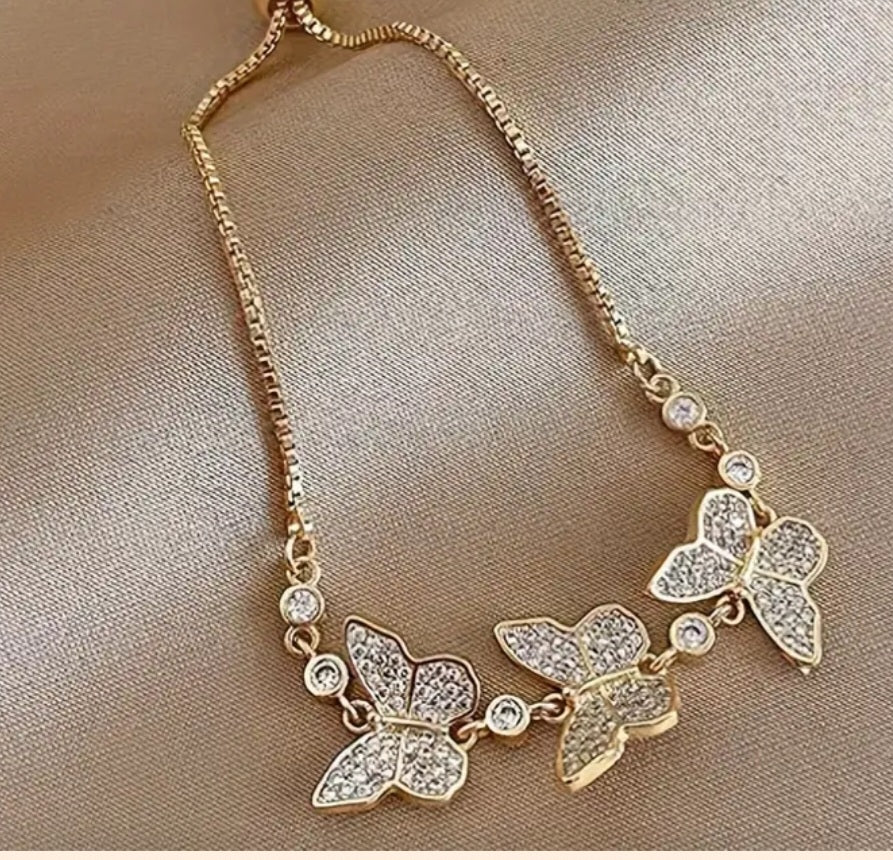 Pulsera ajustable de mariposas con brillantes/Adjustable butterfly bracelet with rhinestones
