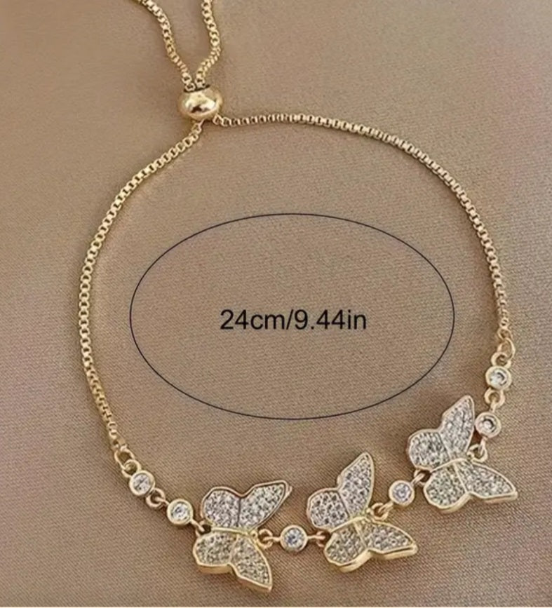 Pulsera ajustable de mariposas con brillantes/Adjustable butterfly bracelet with rhinestones