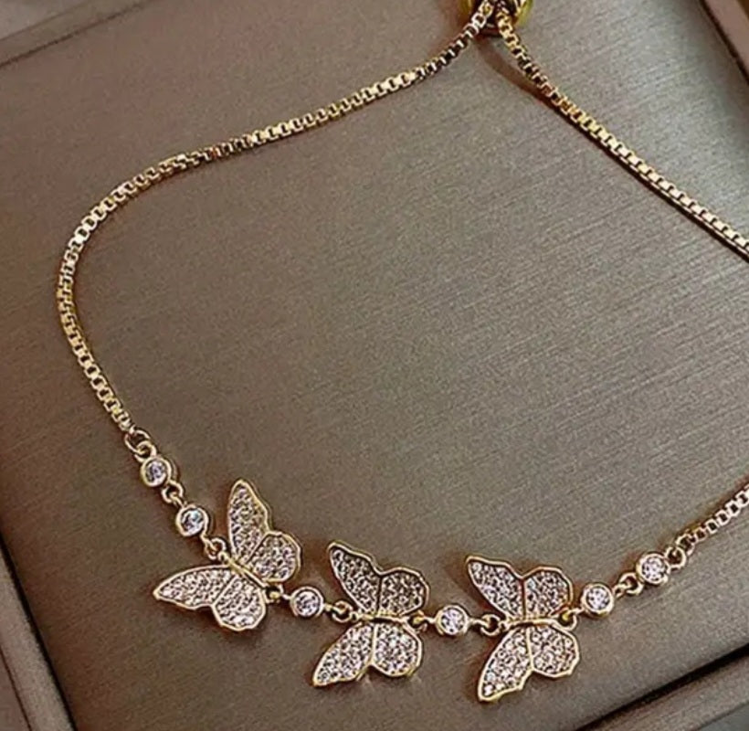 Pulsera ajustable de mariposas con brillantes/Adjustable butterfly bracelet with rhinestones